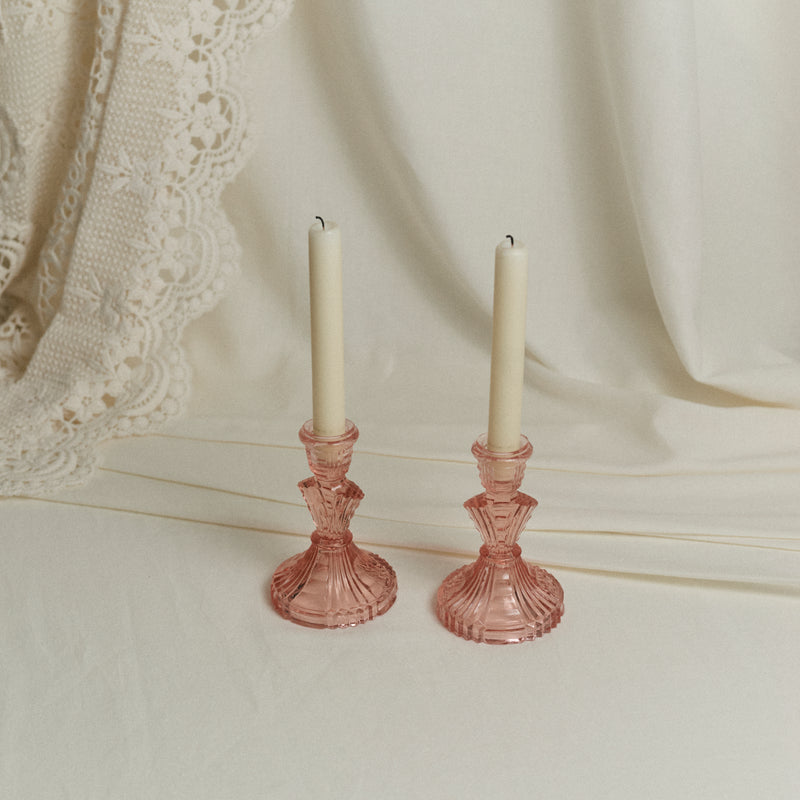 Paire de bougeoirs en verre rose