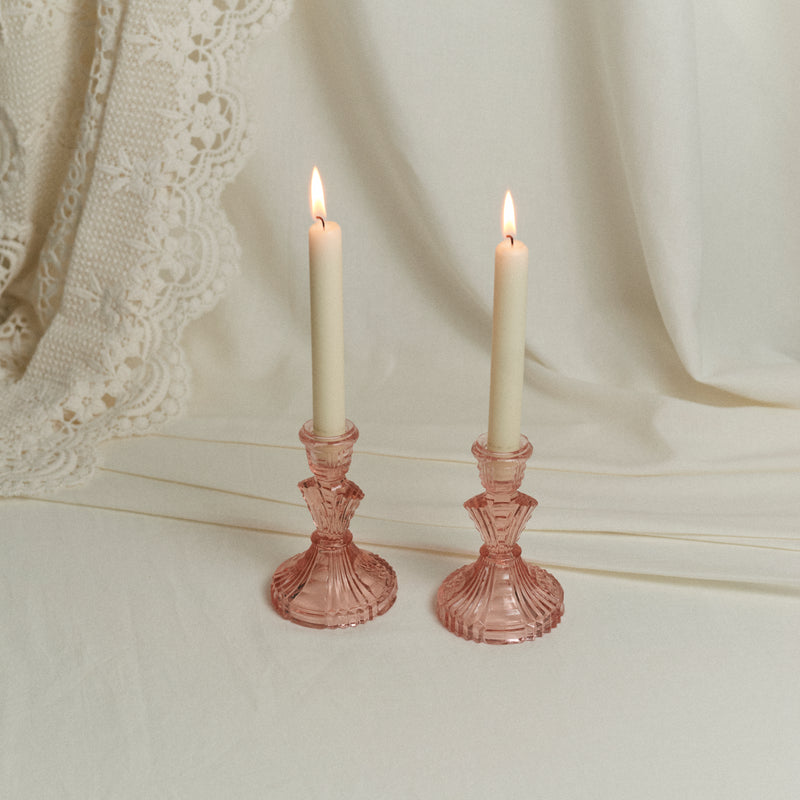 Paire de bougeoirs en verre rose